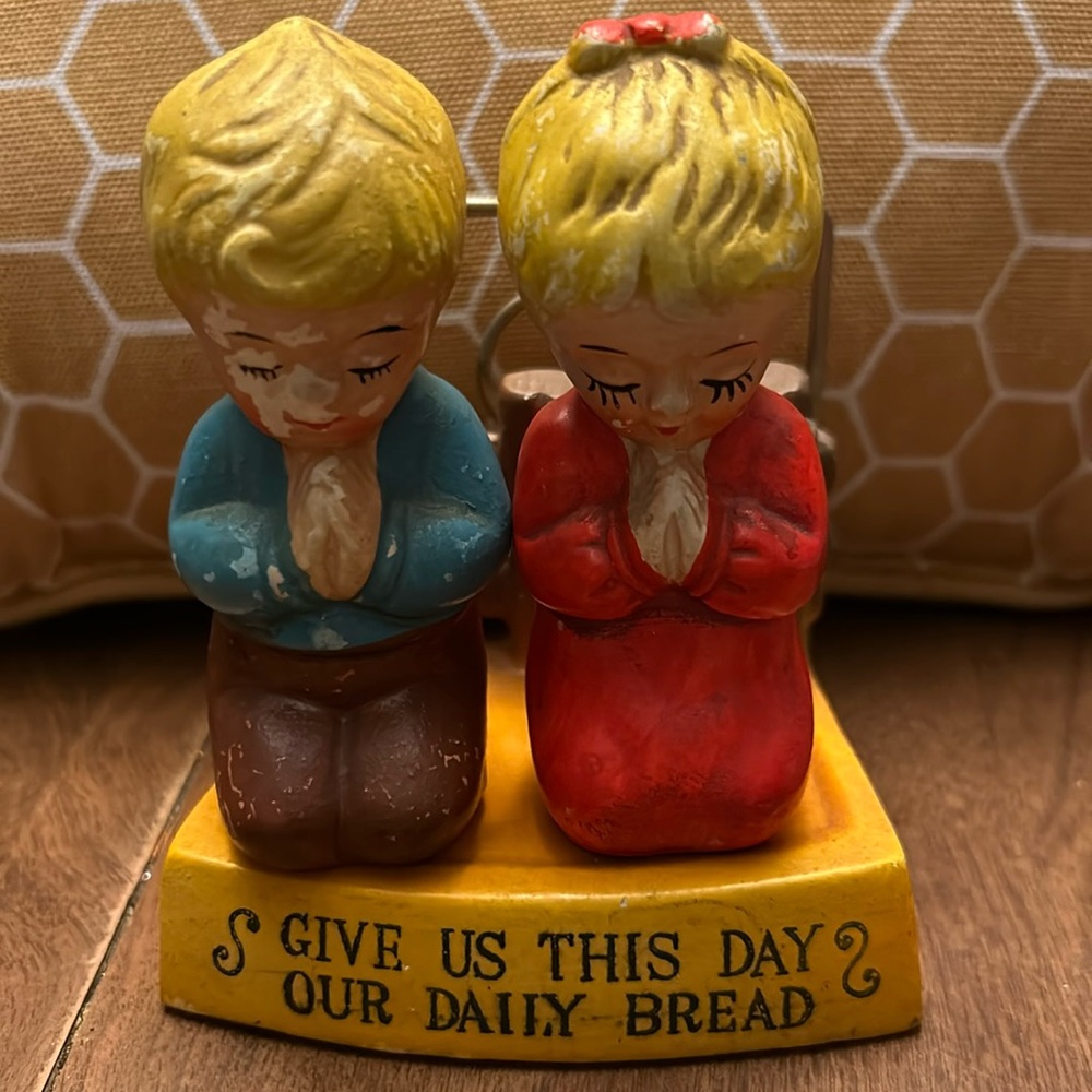 Vintage salt and pepper shakers with base.